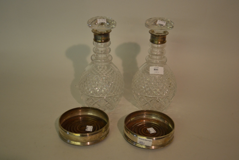 Pair of silver mounted cut glass decanters and a modern silver bottle stand