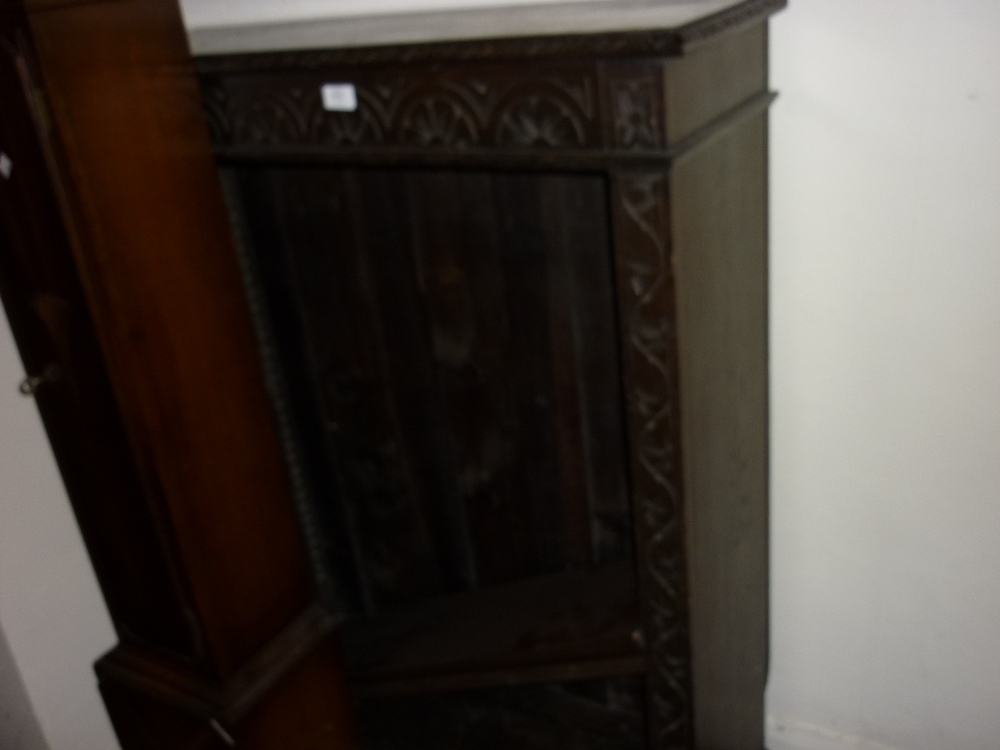 Early 20th Century oak open bookcase having two adjustable shelves with carved decoration