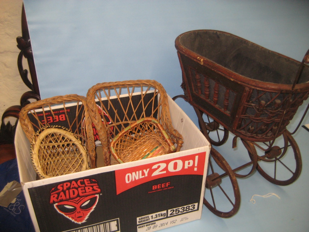 Group of four various dolls, wicker chair and a pram (a/f)