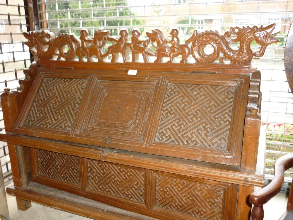 19th Century Indian carved hardwood dowry chest, the hinged arched top with a dragon figure and