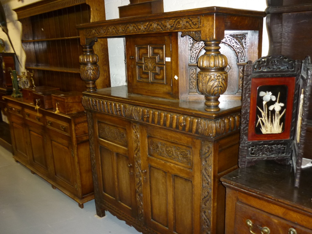 Good quality early 20th Century carved oak court cupboard in Elizabethan style, the canopy top