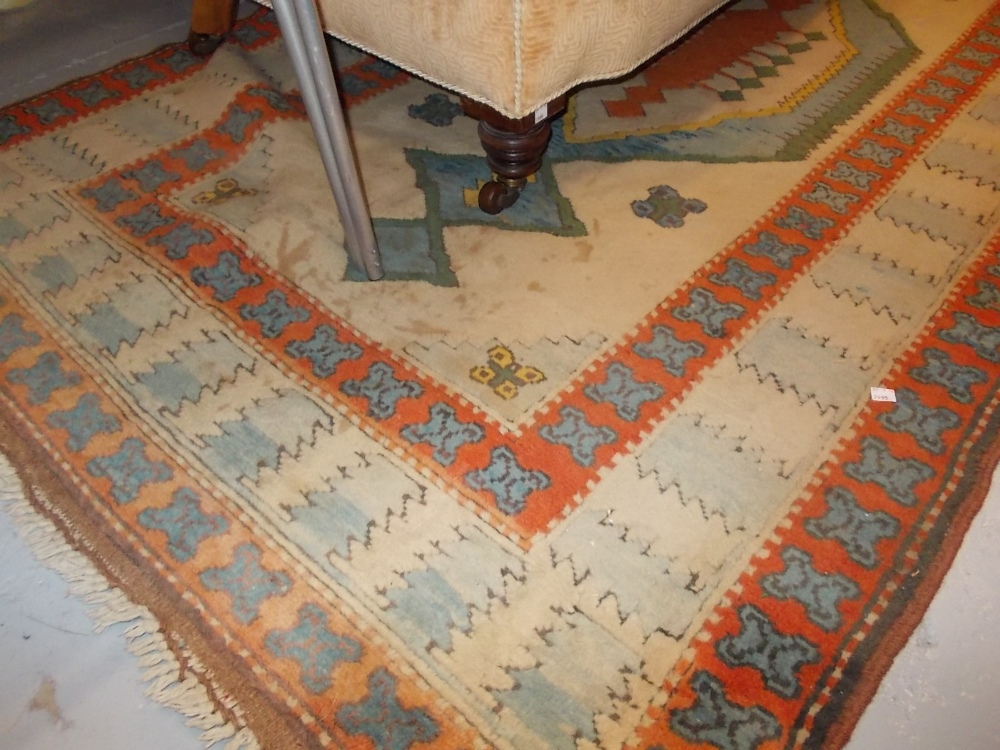 20th Century Turkish Kurdish design rug with single pole medallion on a beige ground with triple