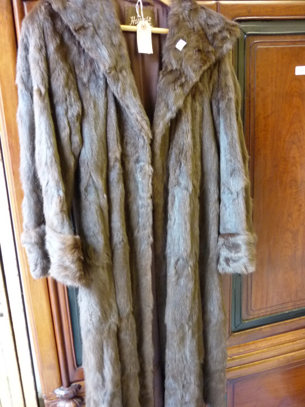 Ladies three quarter length dark brown fur coat with Harrods label