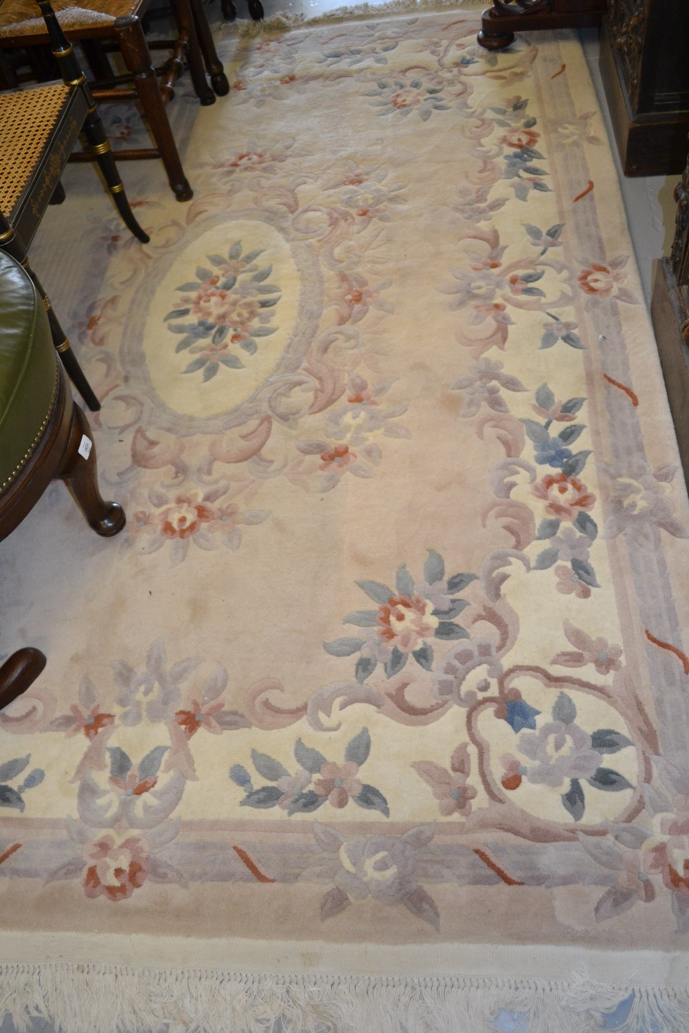 20th Century Chinese floral decorated rug on cream ground