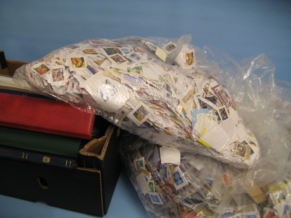 Two bags containing a large quantity of miscellaneous World and G.B. used stamps also contained in
