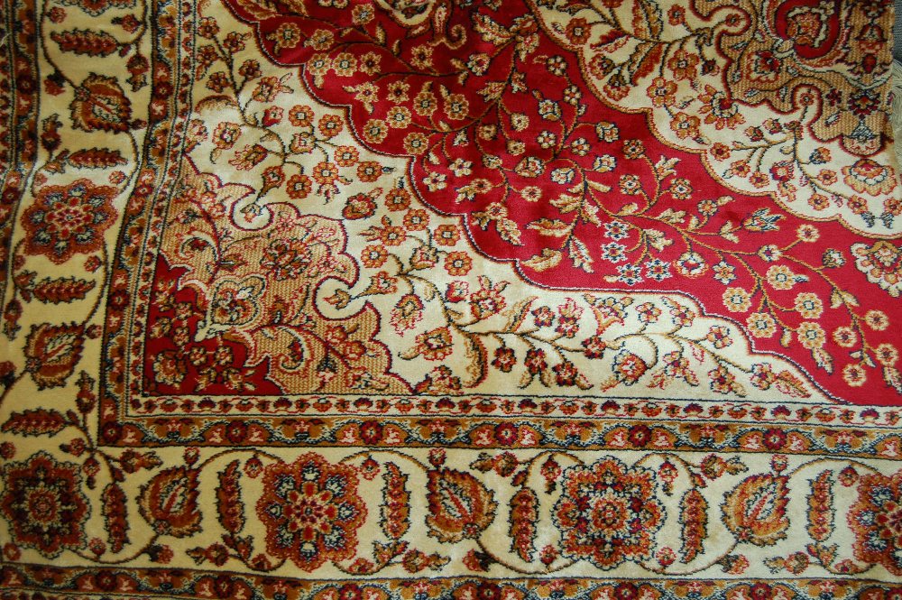 Qum style rug with red ground, 1.9m x 1.4m