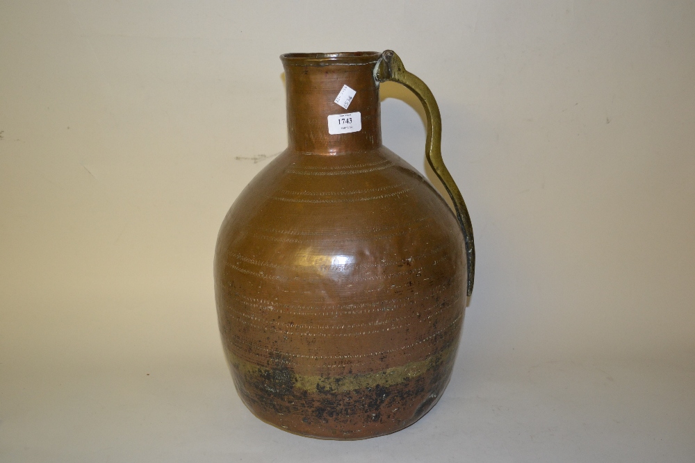 Large Middle Eastern copper and brass flagon