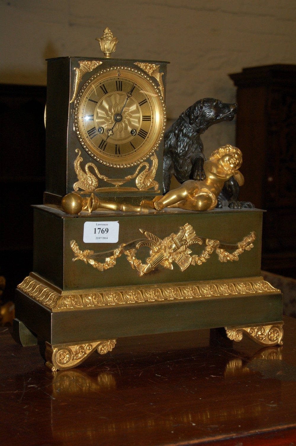 19th Century French Empire bronze and ormolu mounted mantel clock having circular gilt dial with