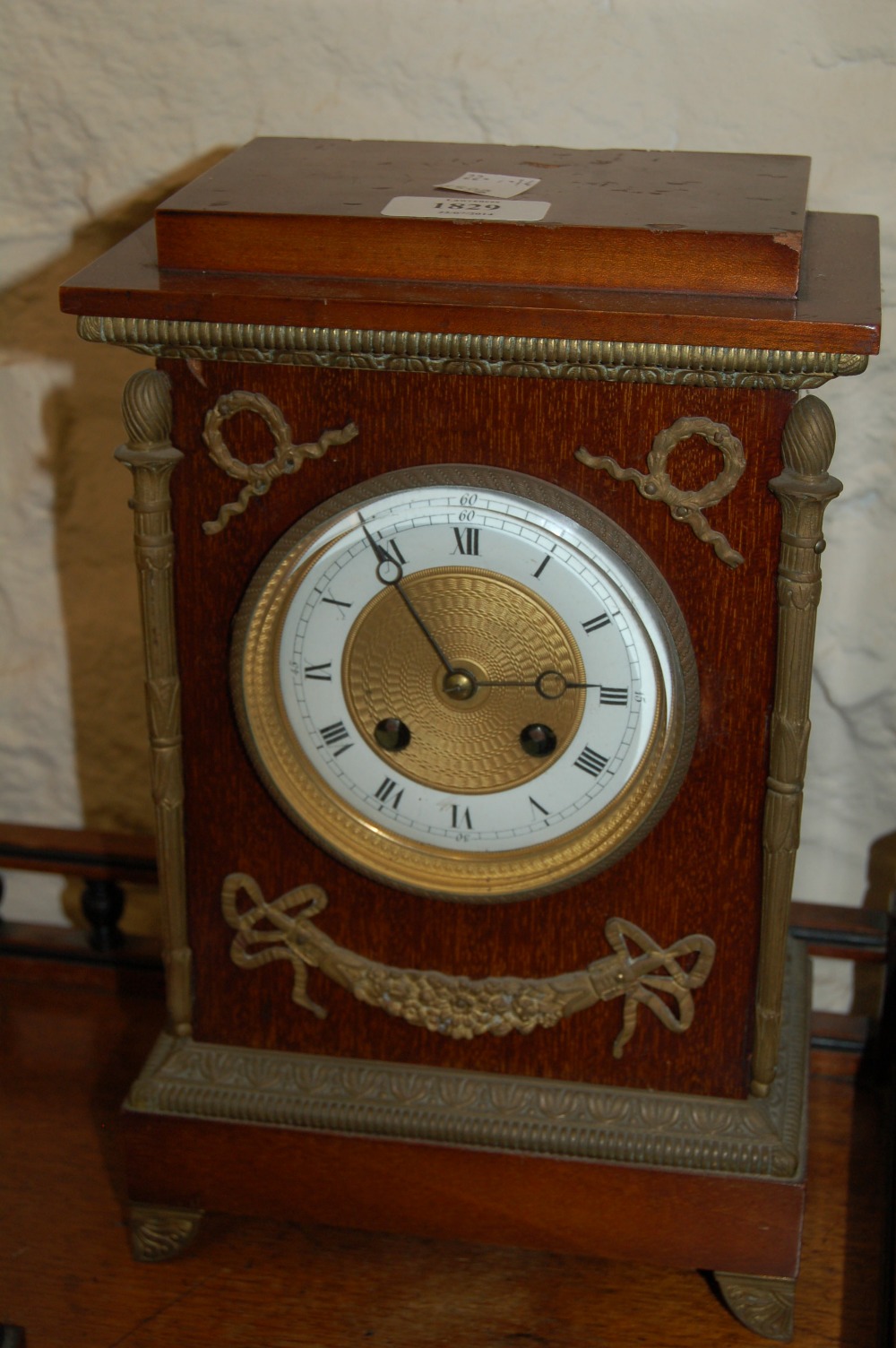 Early 20th Century French mahogany and gilt brass mounted mantel clock, the rectangular case with