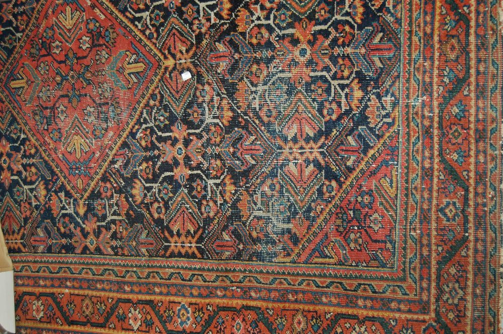 Hamadan rug with medallion and all-over stylised floral design on a midnight blue ground with