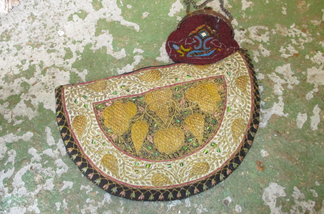 Gold threadwork tea cosy and a glass beadwork evening bag