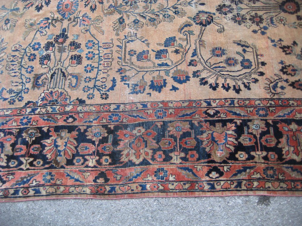19th Century Sarouk carpet with a typical all-over floral design on a brick red field with multiple - Image 5 of 7