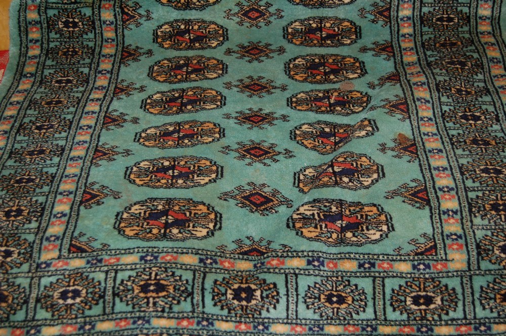 Two Pakistan Bokhara design rugs and three various others