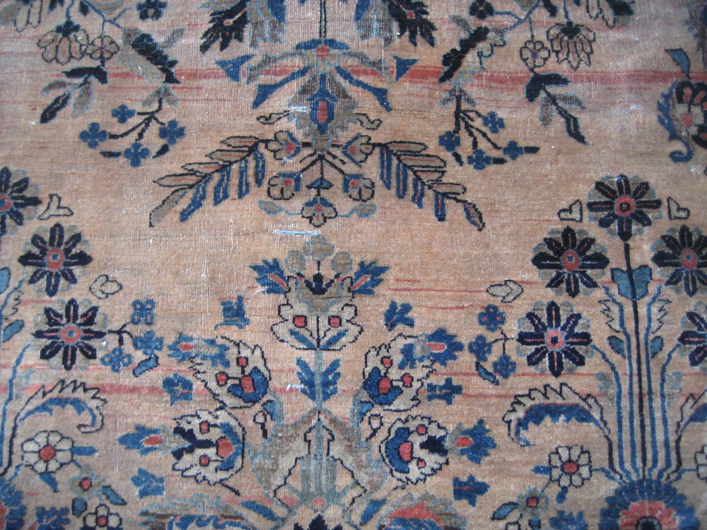 19th Century Sarouk carpet with a typical all-over floral design on a brick red field with multiple - Image 6 of 7