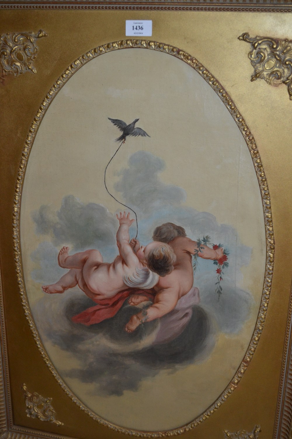 19th Century oil on canvas, study of putti with bird and flowers, oval mounted in a rectangular