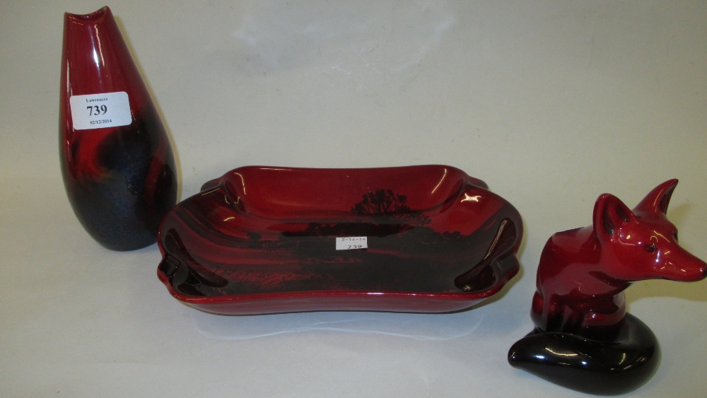 Royal Doulton flambe figure of a seated fox together with a similar baluster form vase and dish