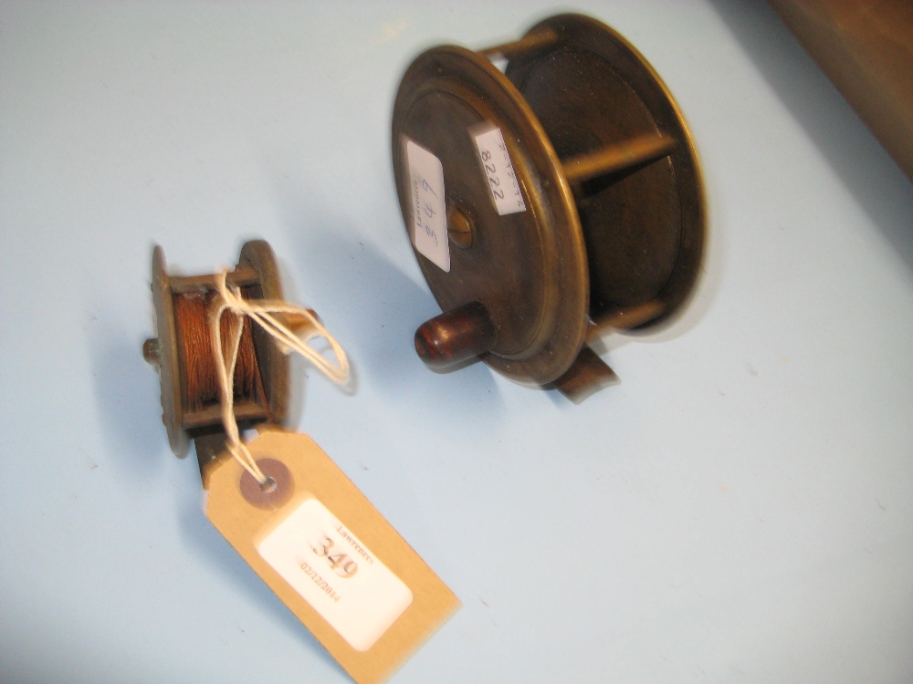 19th Century brass wooden handled fishing reel and another smaller fishing reel