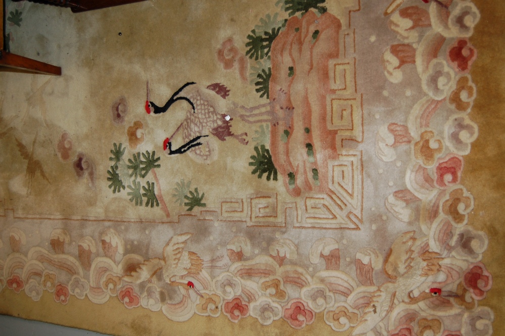 Chinese carpet, the centre medallion of cranes and flowers on a beige ground with matching corner