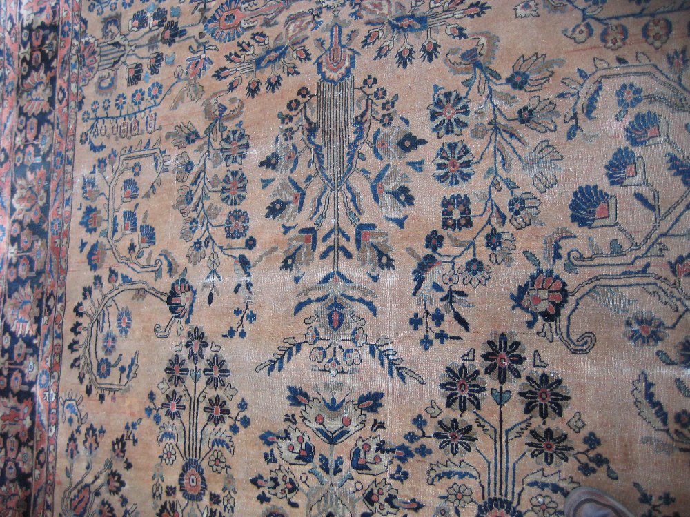 19th Century Sarouk carpet with a typical all-over floral design on a brick red field with multiple - Image 4 of 7