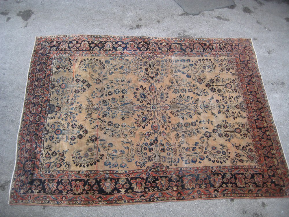 19th Century Sarouk carpet with a typical all-over floral design on a brick red field with multiple - Image 2 of 7