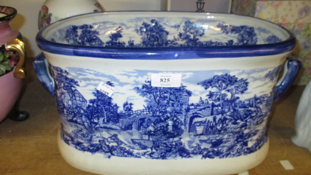 Two handled blue and white decorated footbath and a Portmeirion floral decorated baluster form vase