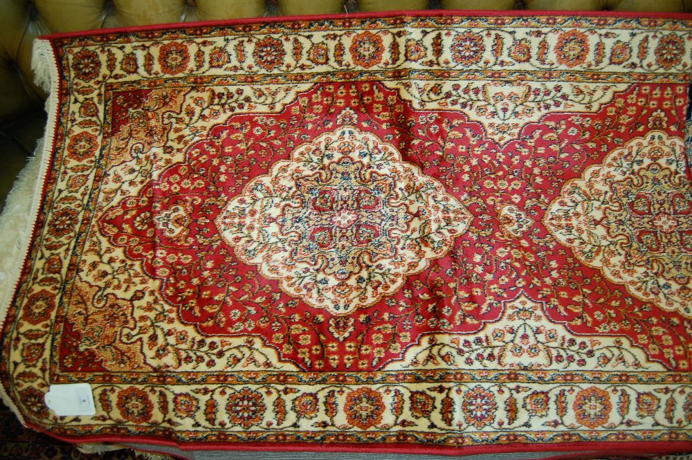 Modern machine woven Kum style runner with red ground 2.1m x 0.7m