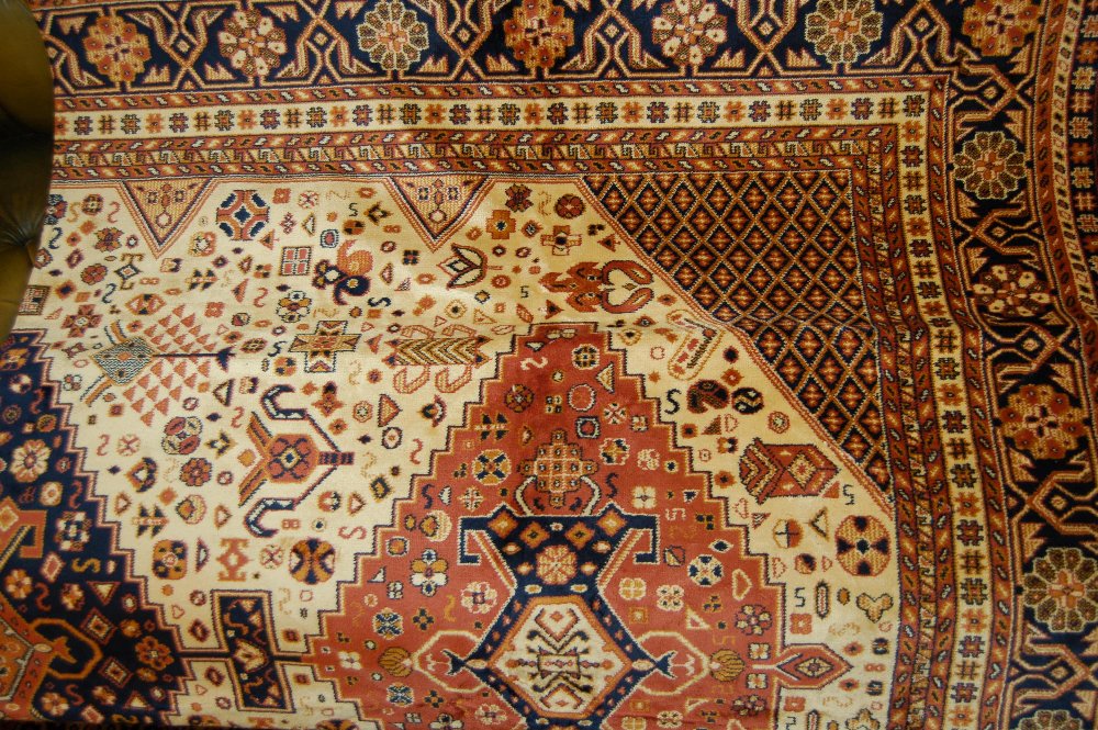 Caucasian style carpet with beige ground, 2.3m x 1.6m