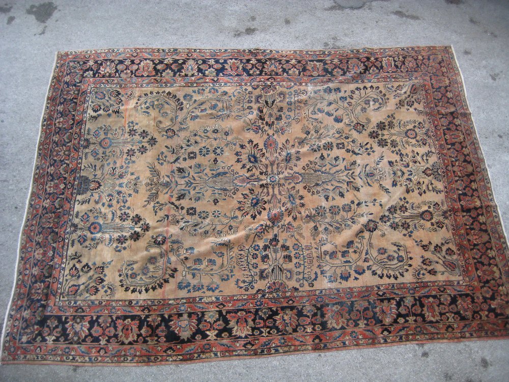 19th Century Sarouk carpet with a typical all-over floral design on a brick red field with multiple