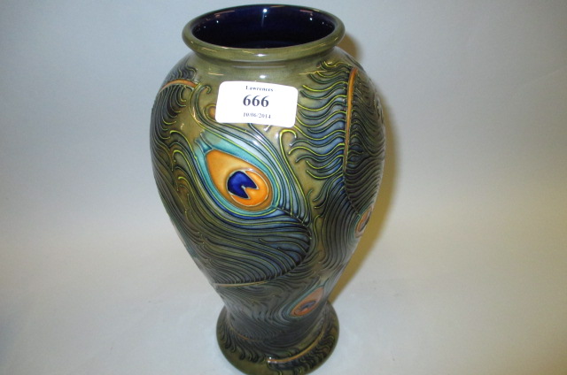Moorcroft baluster form pottery vase decorated in Peacock Feather pattern, 10.25ins high