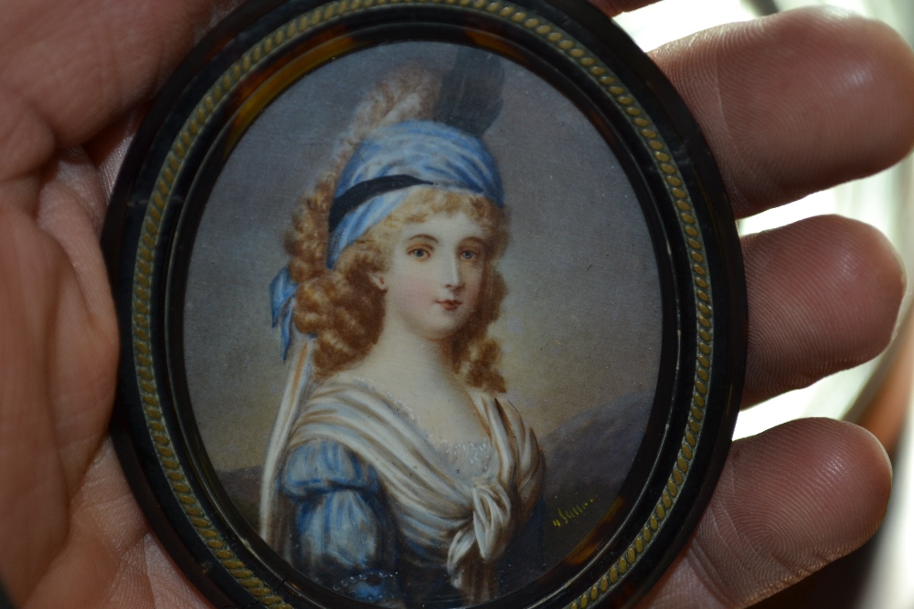 Watercolour, portrait miniature of a girl wearing a blue bonnet and dress, indistinctly signed in