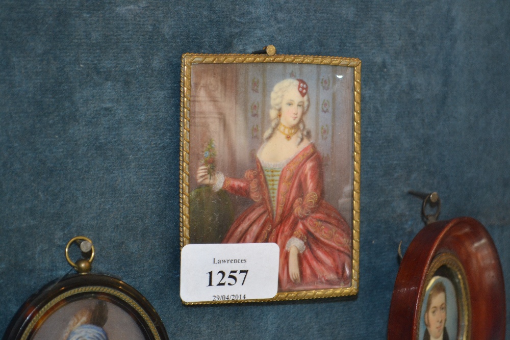 Watercolour, portrait miniature of a lady wearing a red dress