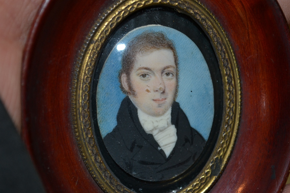 Small 19th Century watercolour, portrait miniature of a gentleman in an oval stained and gilt