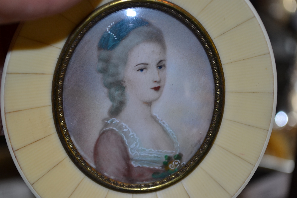 Watercolour, portrait miniature of a girl wearing a pink dress in a simulated ivory oval frame