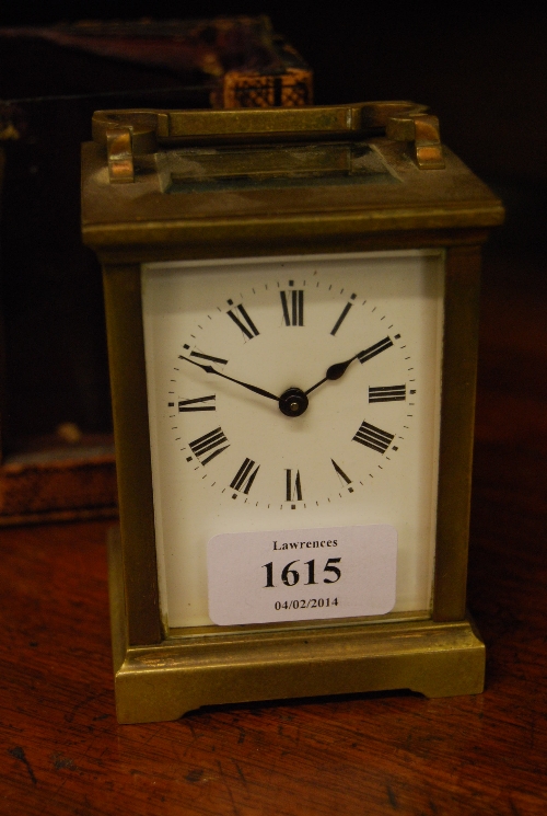 20th Century gilt brass cased carriage clock having enamel dial with Roman numerals and single train