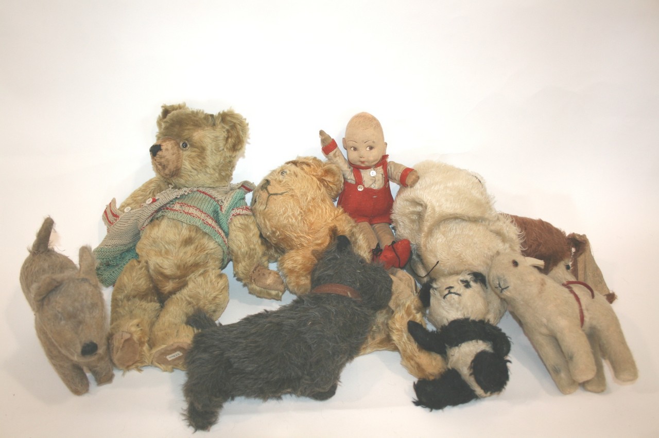 VINTAGE TEDDY BEAR a vintage Bear (one eye missing), also with a variety of soft toys including