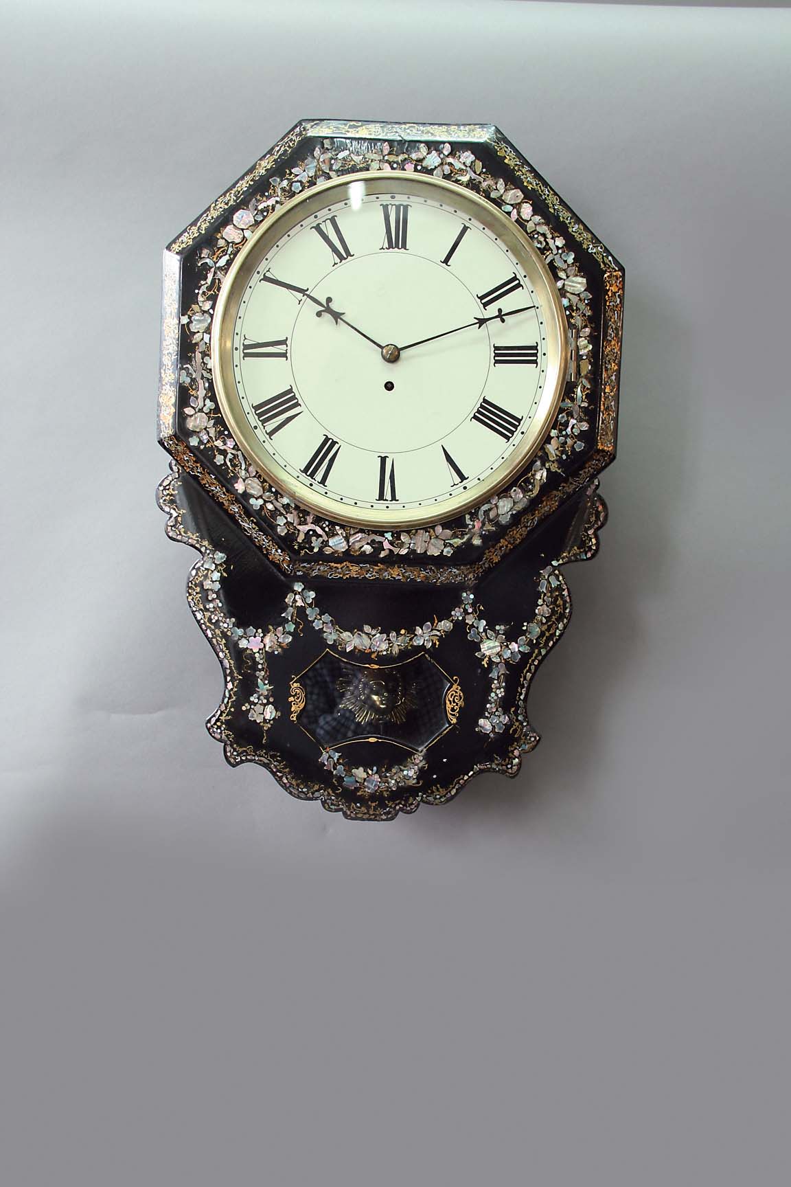 A PAPIER MACHE AND MOTHER OF PEARL INLAID WALL CLOCK dial cream painted, movement fusee with a