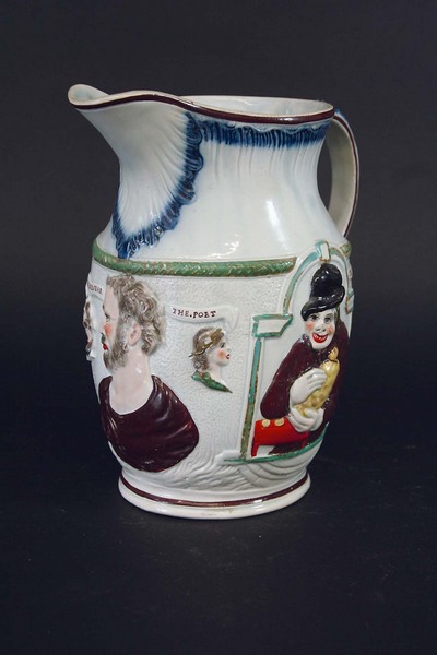 A SHAKESPEARE AND MISER JUG moulded in low relief with appropriate figures,  7 3/4ins.(19.5cms)