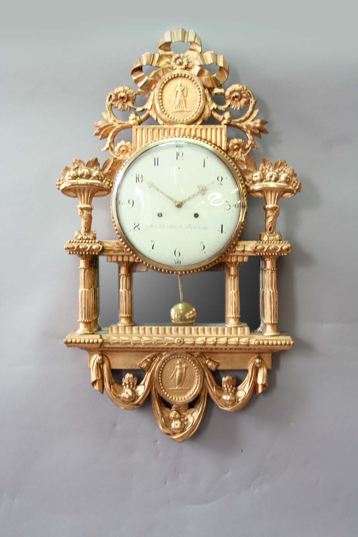 AN 18TH CENTURY SWEDISH GILTWOOD WALL CLOCK dial cream enamel, signed And..Lundfledl. Stockholm,