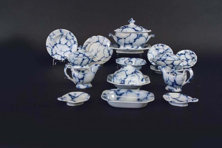 AN EXTENSIVE CHILDS BLUE AND WHITE "MARBLED" DINNER SERVICE comprising: soup tureen, cover, stand