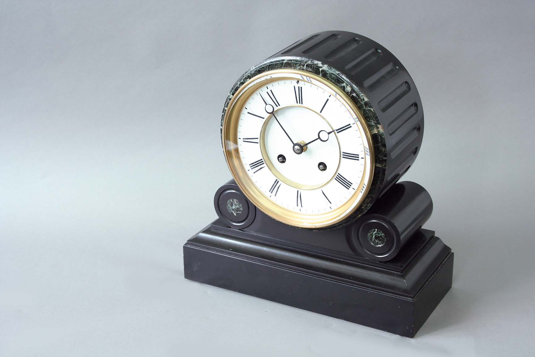 A LARGE BLACK MARBLE MANTEL CLOCK dial white enamel, movement drum, signed Howell James & Co.,