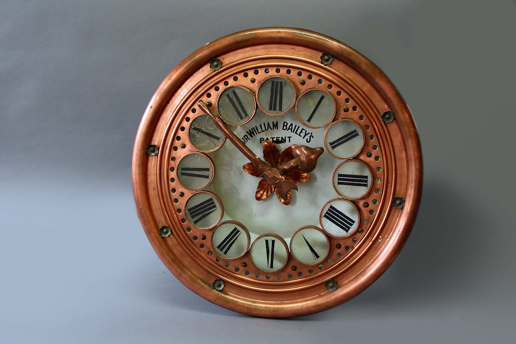 A SIR WILLIAM BAILEY COPPER ARTS AND CRAFTS WALL CLOCK movement chain fusee, platform escapement and