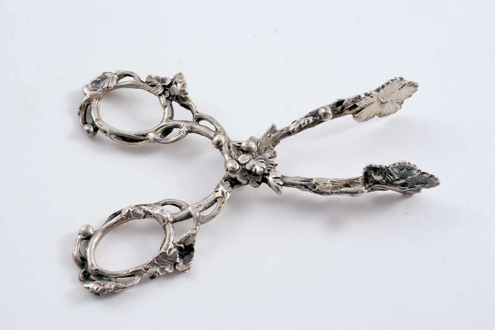 A PAIR OF EARLY VICTORIAN CAST, NATURALISTIC SUGAR NIPS with openwork arms & handles & leaf bowls,