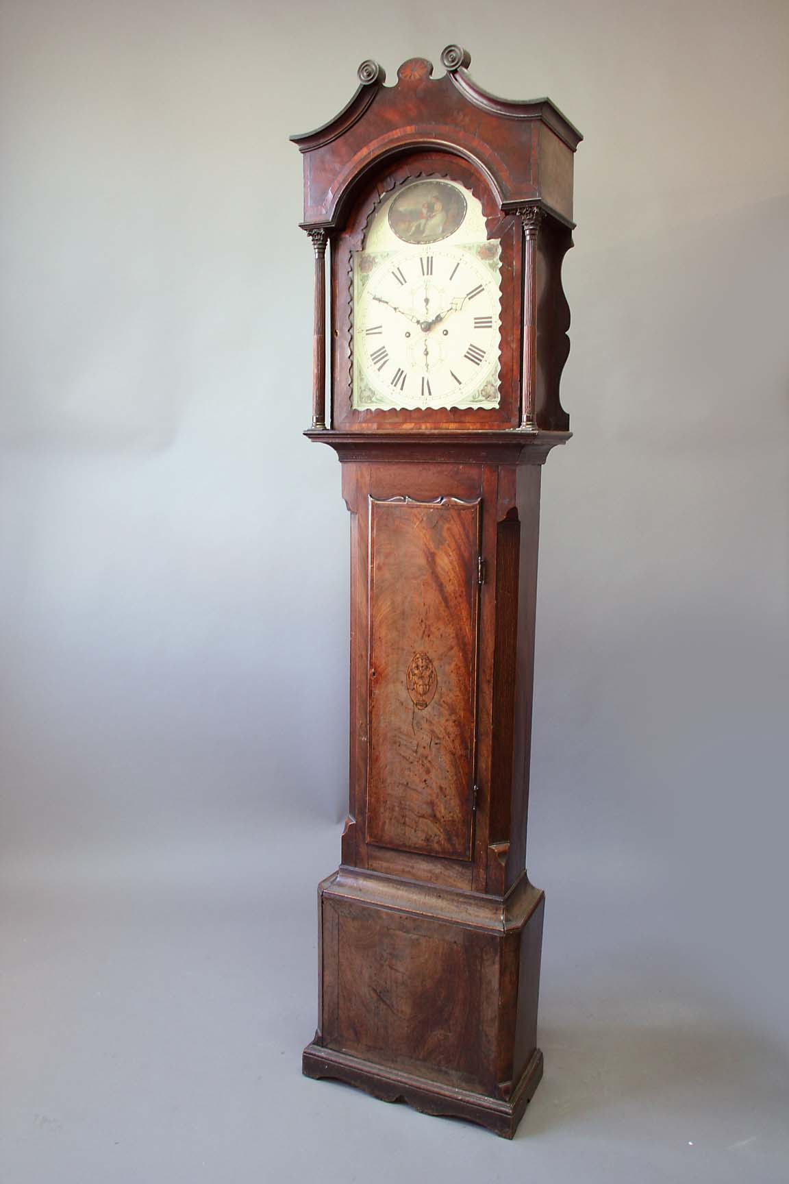 A MAHOGANY LONGCASE CLOCK dial cream painted, subsidiary seconds ring and calendar ring, the arch