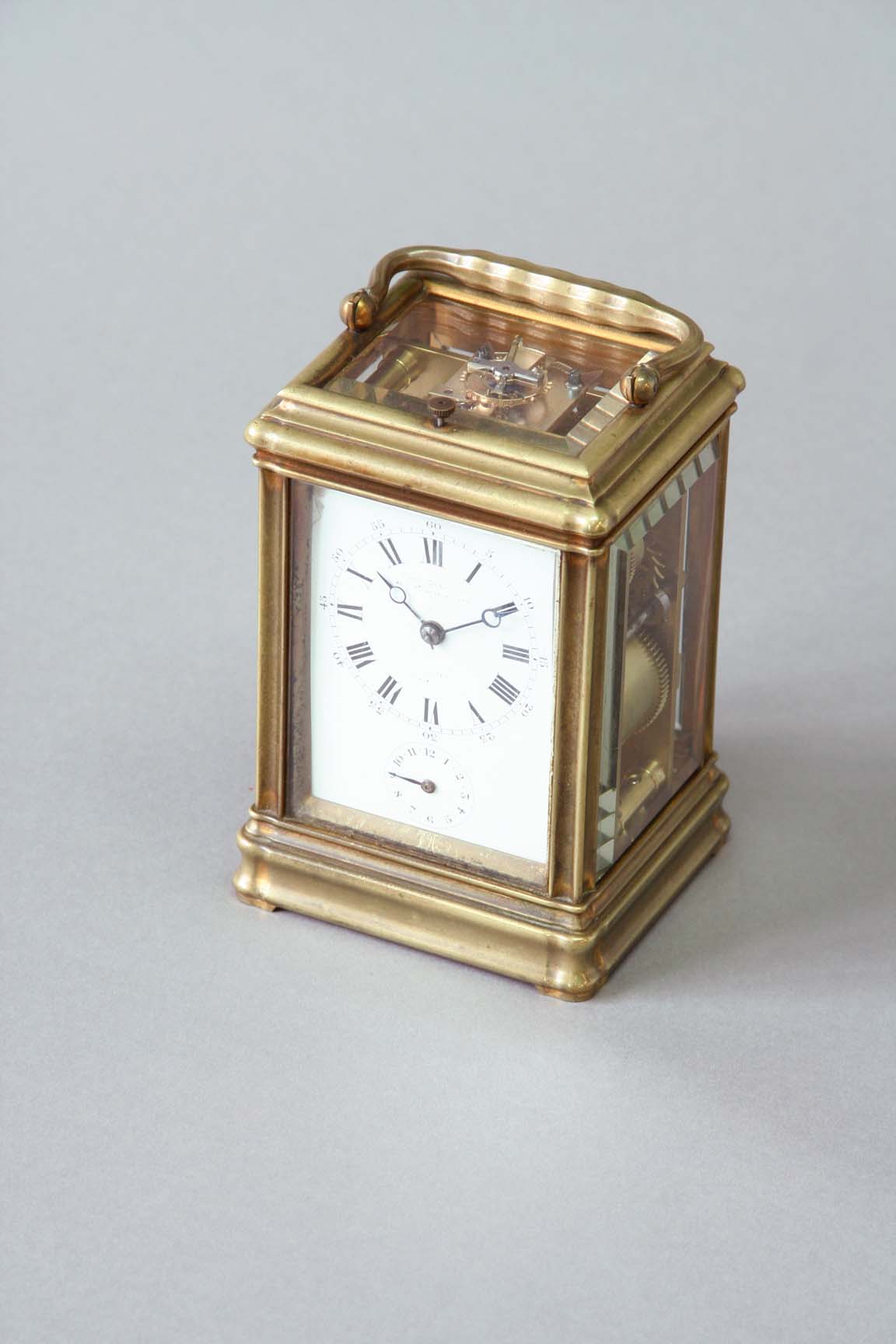 A CARRIAGE CLOCK dial white enamel, indistinctly signed, subsidiary alarum dial, movement repeating,