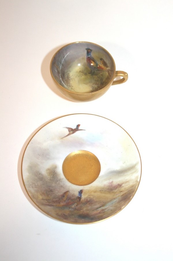 ROYAL WORCESTER - STINTON a cabinet cup and saucer, painted with Game Birds. With an additional