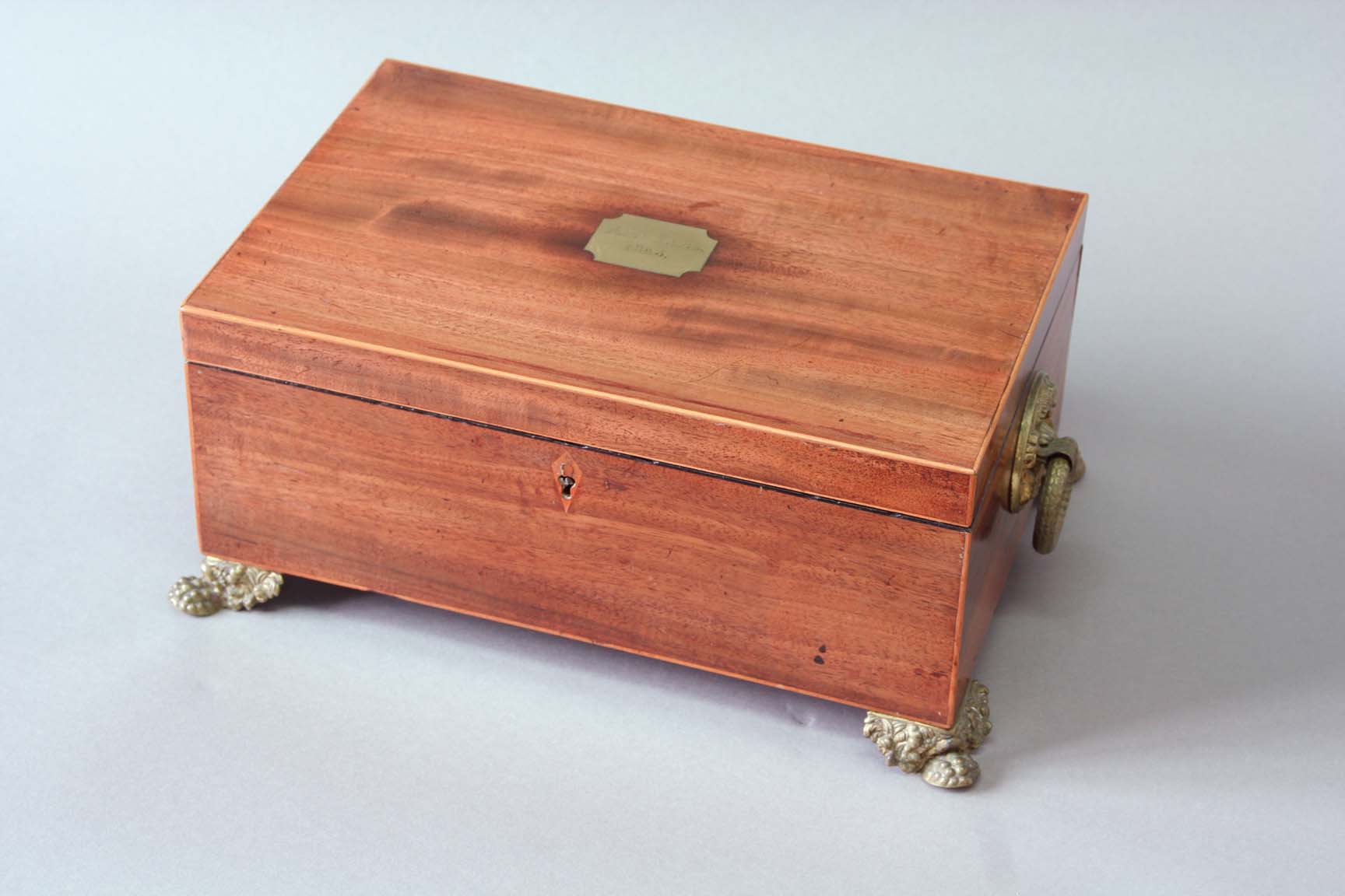 A GEORGE IV MAHOGANY SEWING BOX with boxwood stringing, the lid with a brass tablet engraved Ann