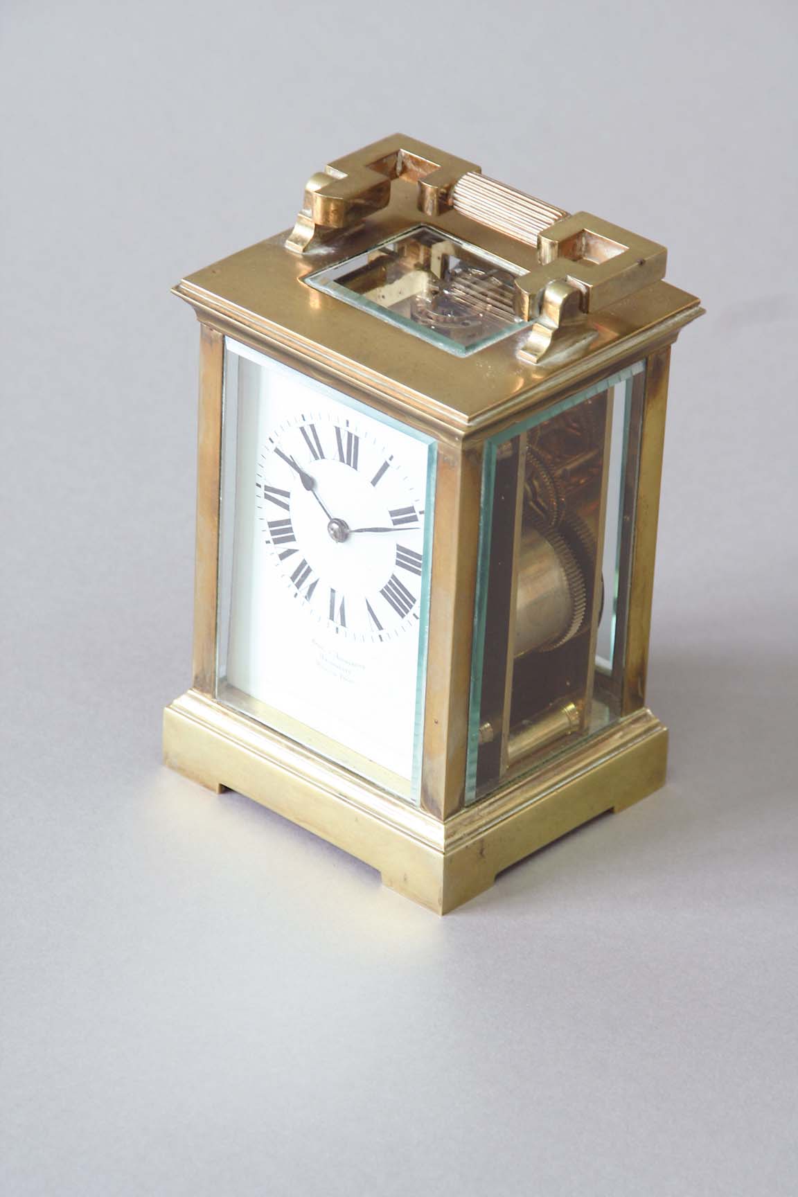A CARRIAGE CLOCK dial white enamel, signed Snow & Ashworth, Harrogate, movement lever escapement