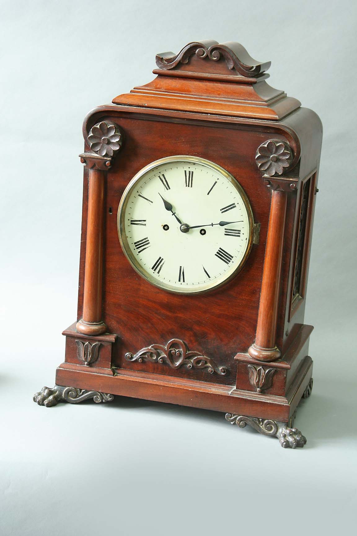 A MAHOGANY BRACKET CLOCK dial cream painted, movement arched backplate, striking on a bell, case