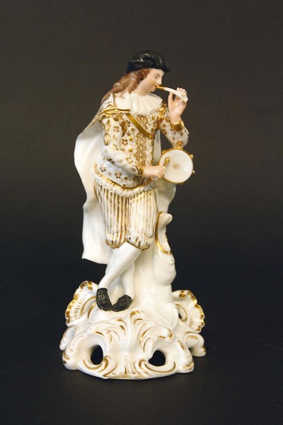 A DERBY FIGURE  of a youthful tambourine and horn player, with gilt enriched clothing, iron red