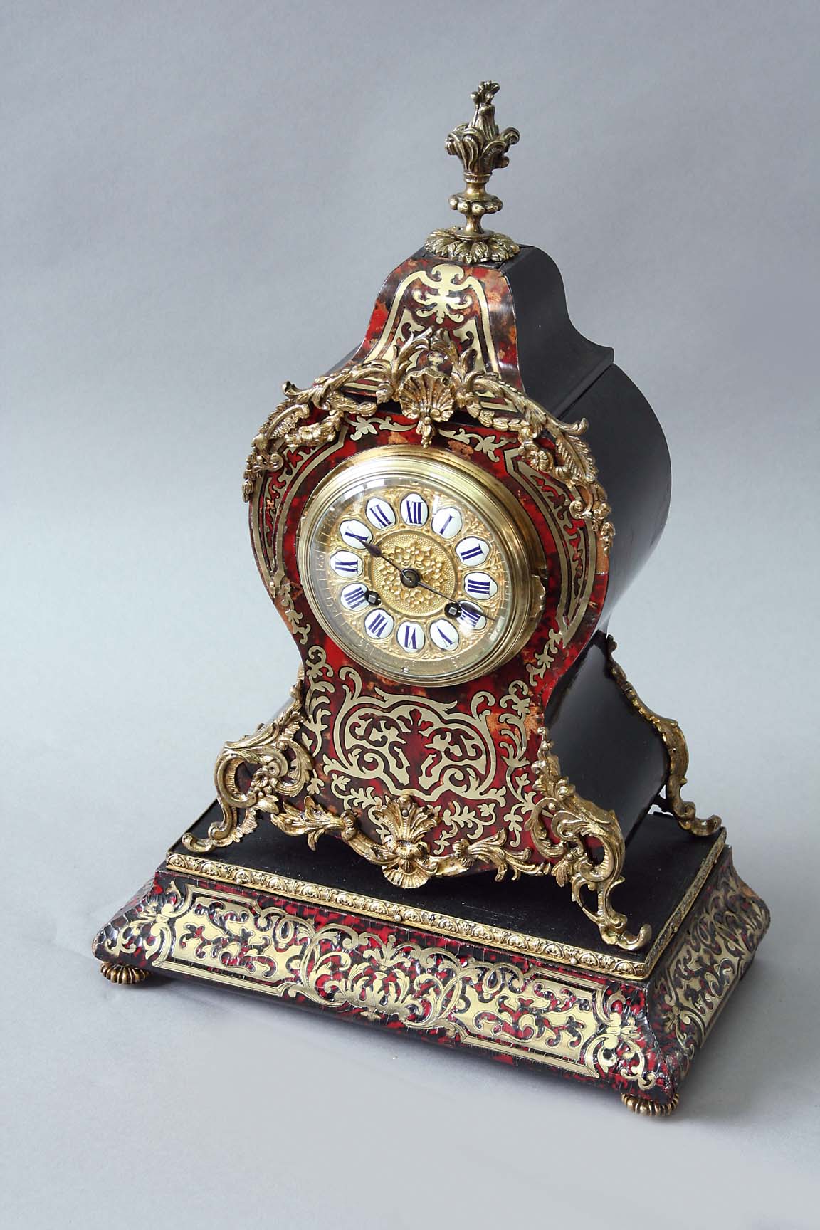 A BOULLE FACED MANTEL CLOCK dial ormolu with blue and white enamel numerals, movement drum, signed